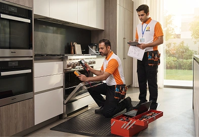 Reno Appliances Repair technician repairing a gas cooker in Dubai